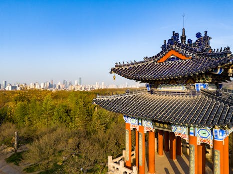 pexels-photo-20827663-20827663 Scenic view of a traditional Chinese pavilion with the Nanjing city skyline in the background.