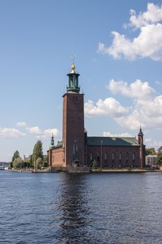 pexels-photo-33196586-33196586 Beautiful view of Stockholm City Hall by the water on a sunny day.